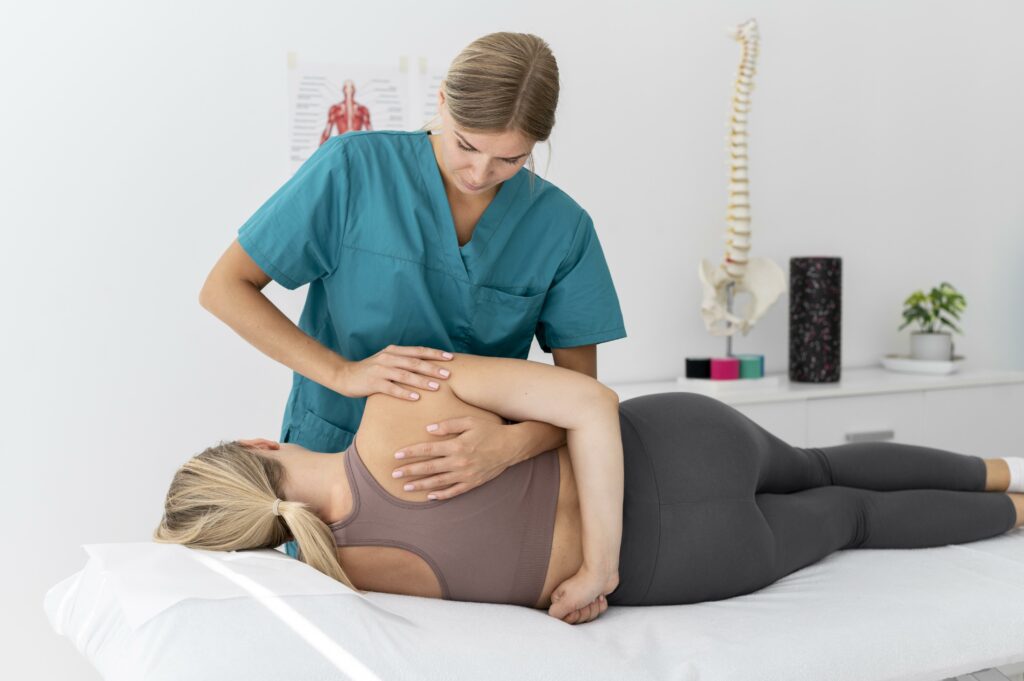 physiotherapist-helping-patient-her-clinic